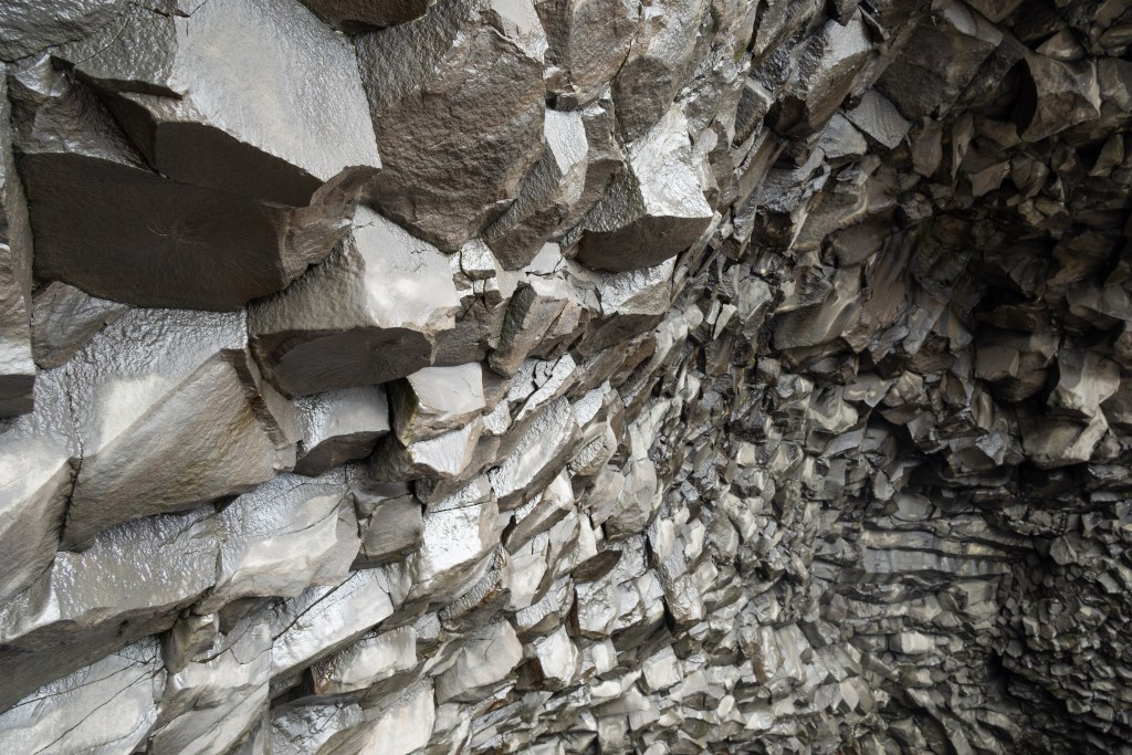 Basalt rock formations at Reynisfjara black sand beach in Iceland