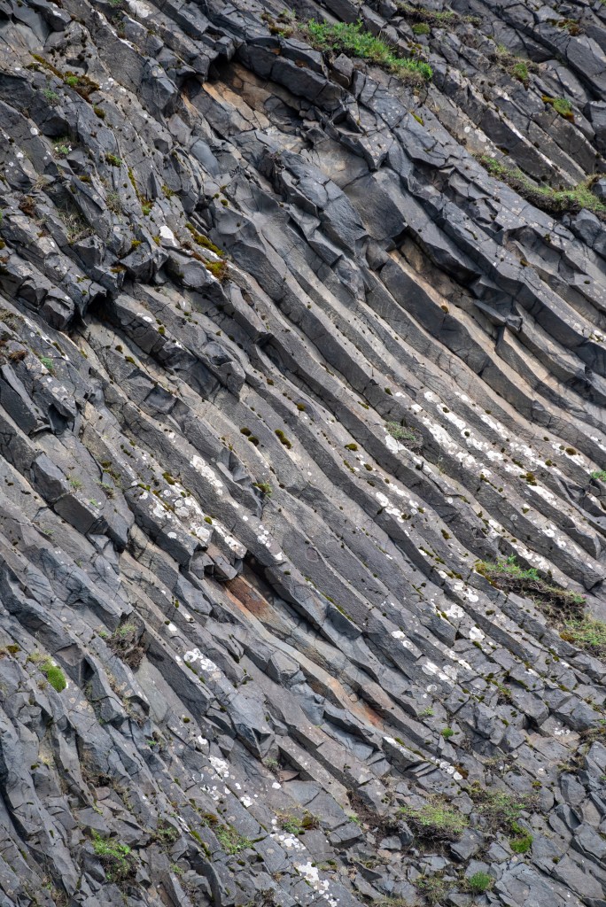 Rock formations at Reynisfjara black sand beach in Iceland