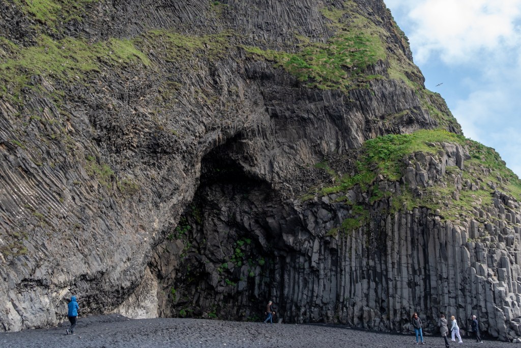 Basalt columns and cavern at Reynisfjara black sand beach in Iceland
