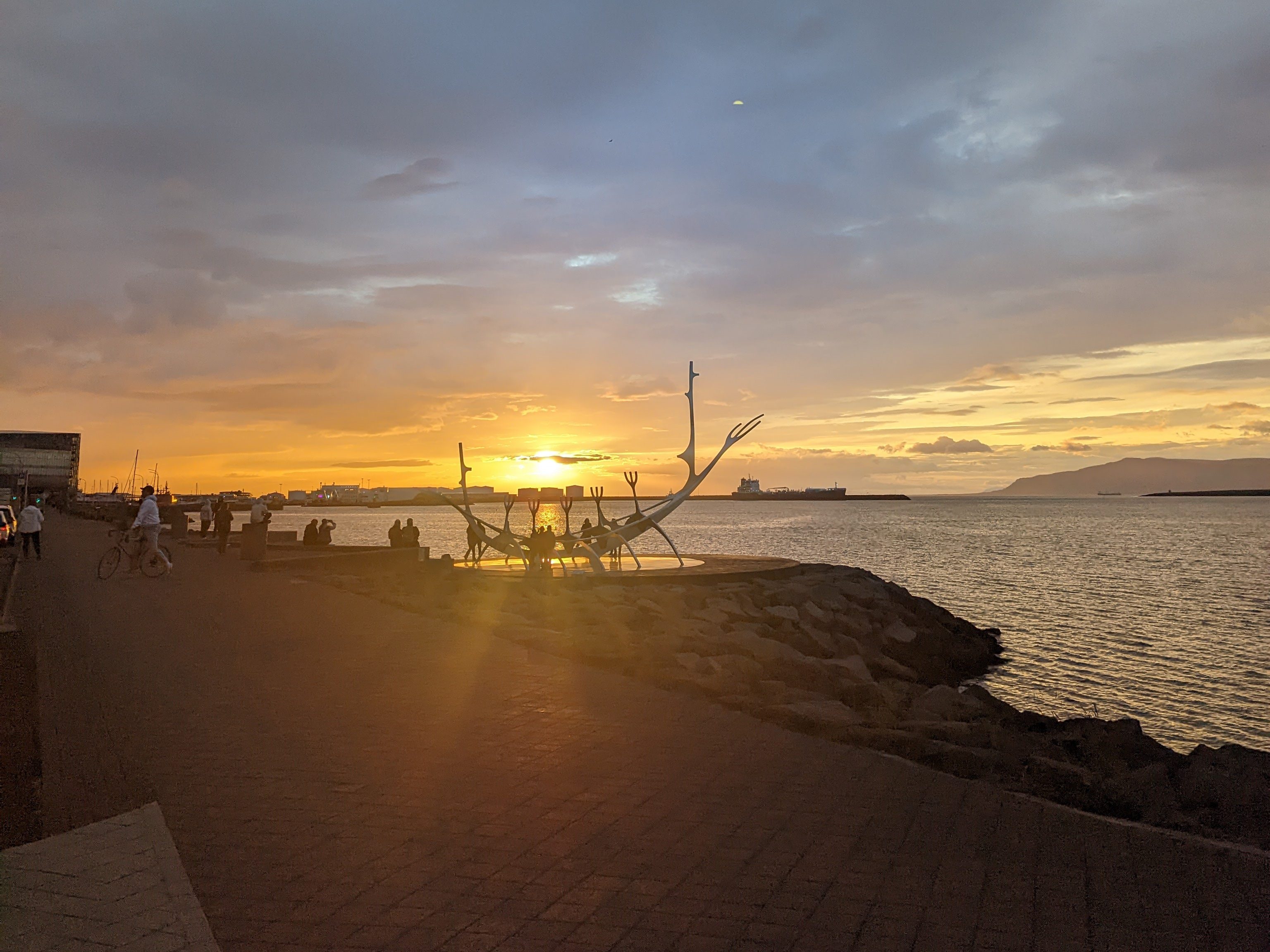 The Sun Voyager sculpture in Reykjavik, Iceland during the midnight sunset