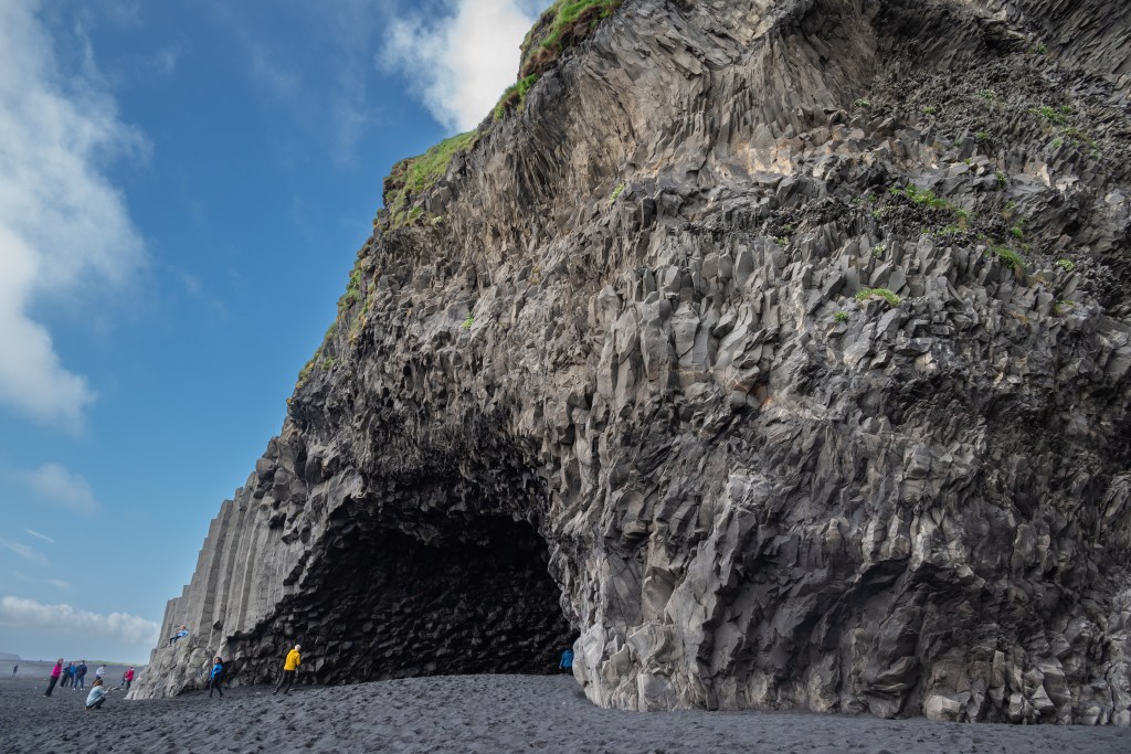 Basalt columns and cavern at Reynisfjara black sand beach in Iceland