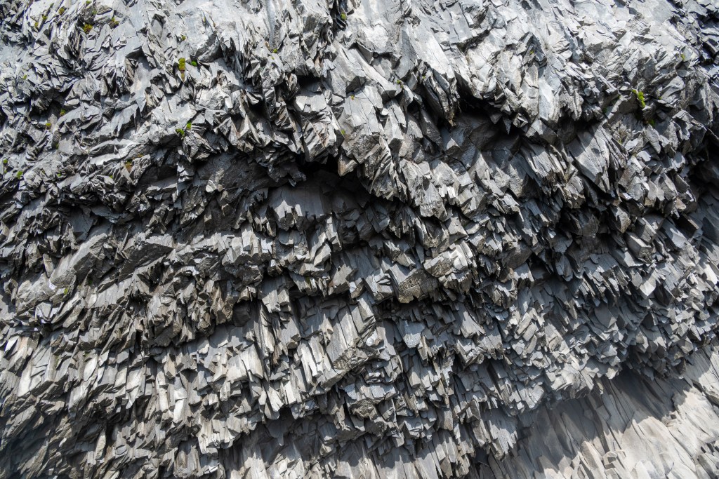 Rock formations at Reynisfjara black sand beach in Iceland