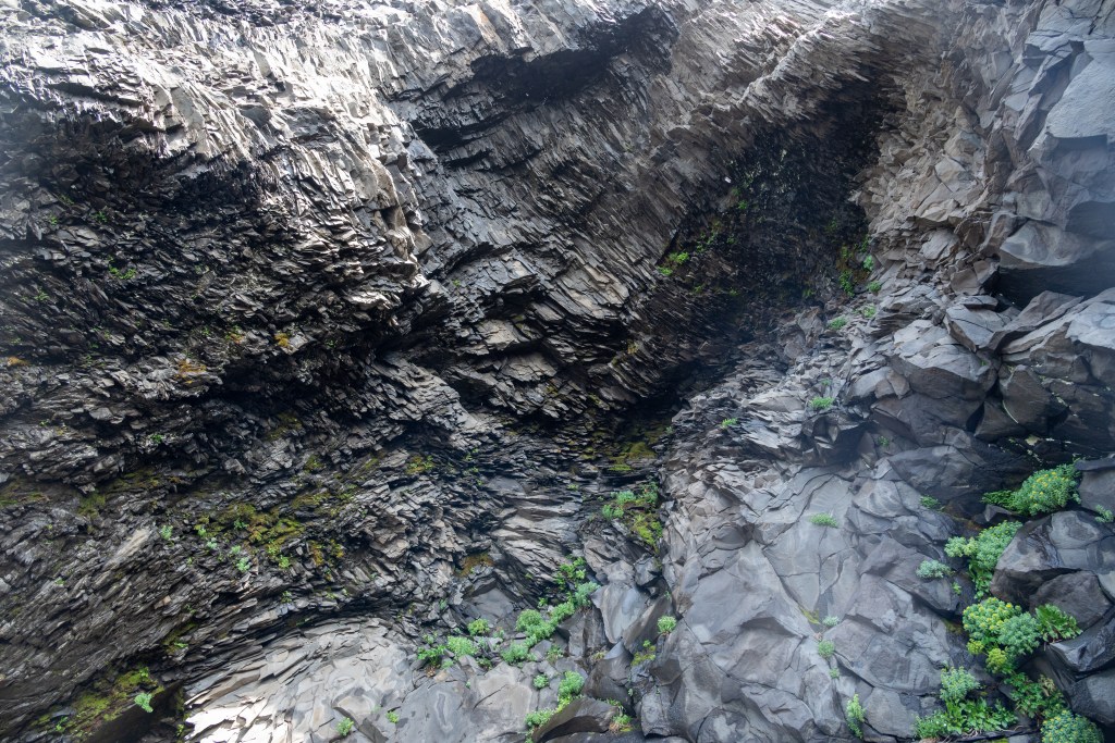 Rock formations at Reynisfjara black sand beach in Iceland