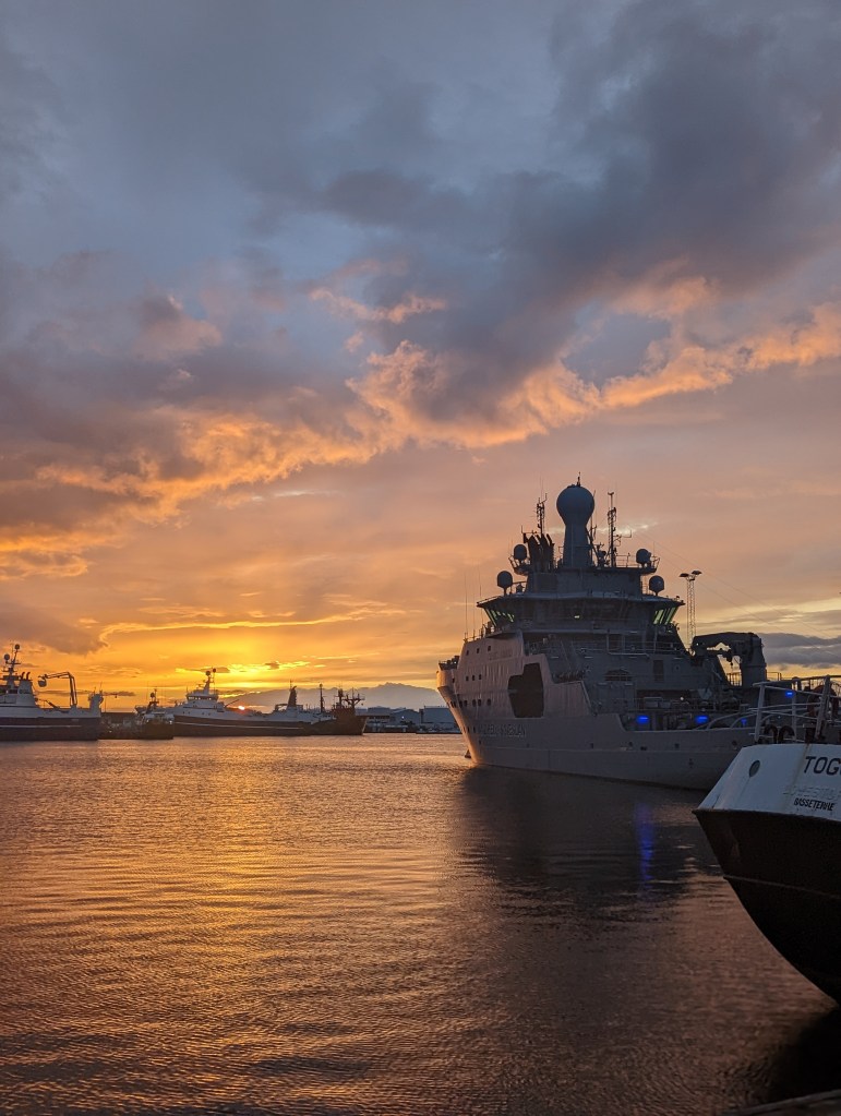 The midnight sunset in Reykjavik, Iceland over the harbor